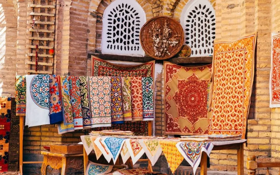 Carpets and textiles displayed outside a shop in the medina