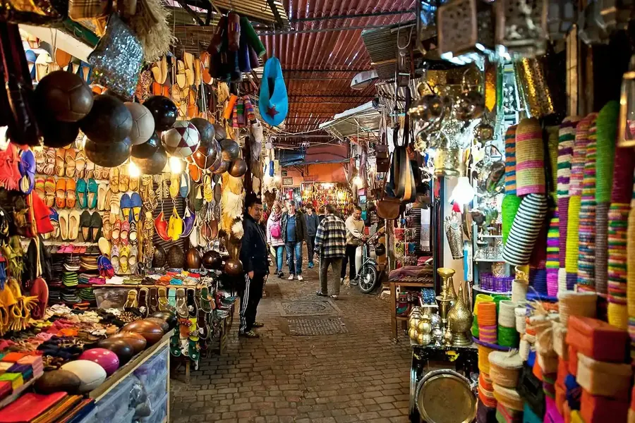 A covered souk in Marrakech full of lanterns and crafts