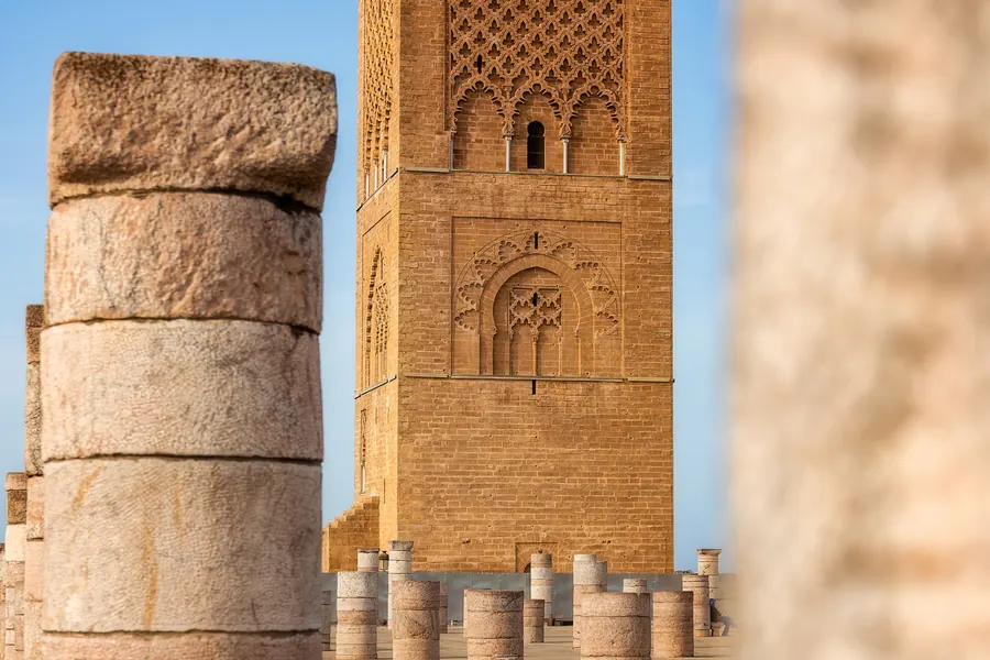 The Hassan Tower seen between ancient columns in Rabat