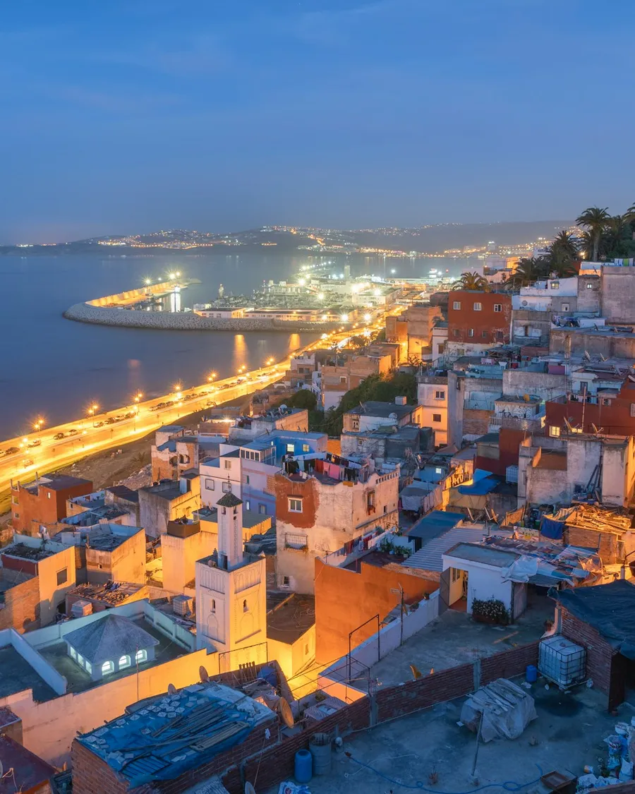 The white houses of Tangier above its bay in the evening