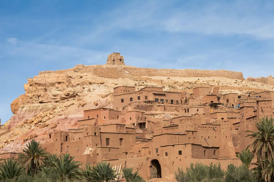 Mud-brick houses stacked up the hillside of Aït Benhaddou