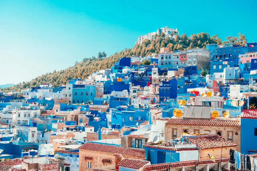 The blue and white houses of Chefchaouen climbing a hillside in the Rif