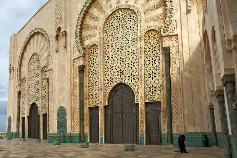 The ornate façade and minaret of the Hassan II Mosque in Casablanca